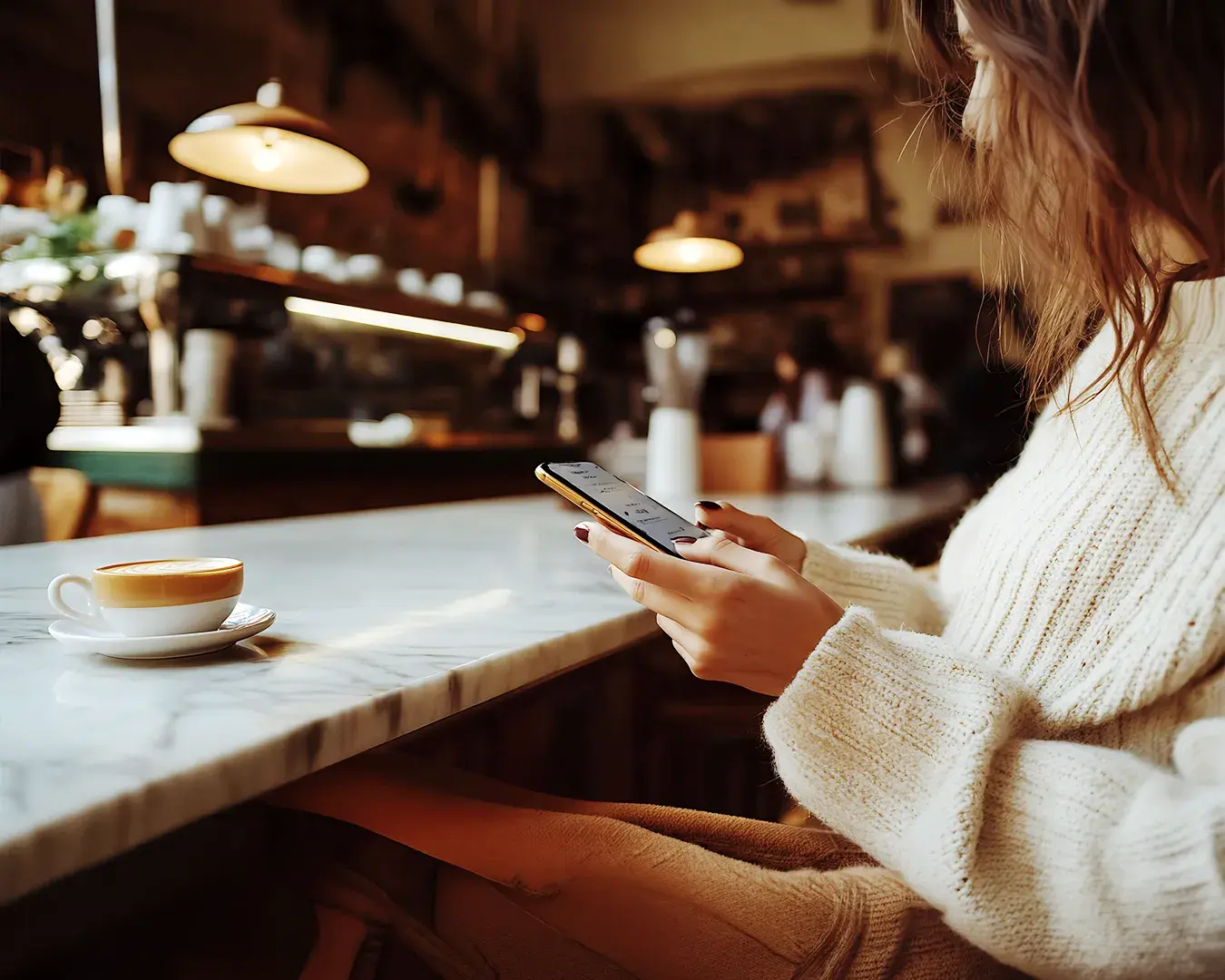 Restaurant customer using smartphone in a café to search for nearby dining options, illustrating local SEO Singapore, mobile search behavior, online visibility, and local customer discovery.
