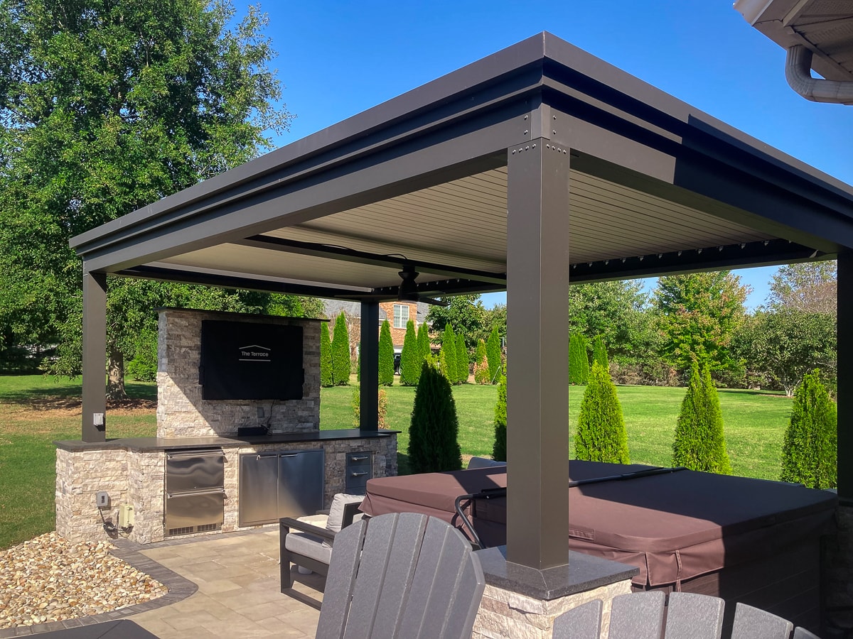 Go with an aluminum pergola as opposed to a custom wood pergola.  You'll get decades of fun and enjoyment out of your backyard space.