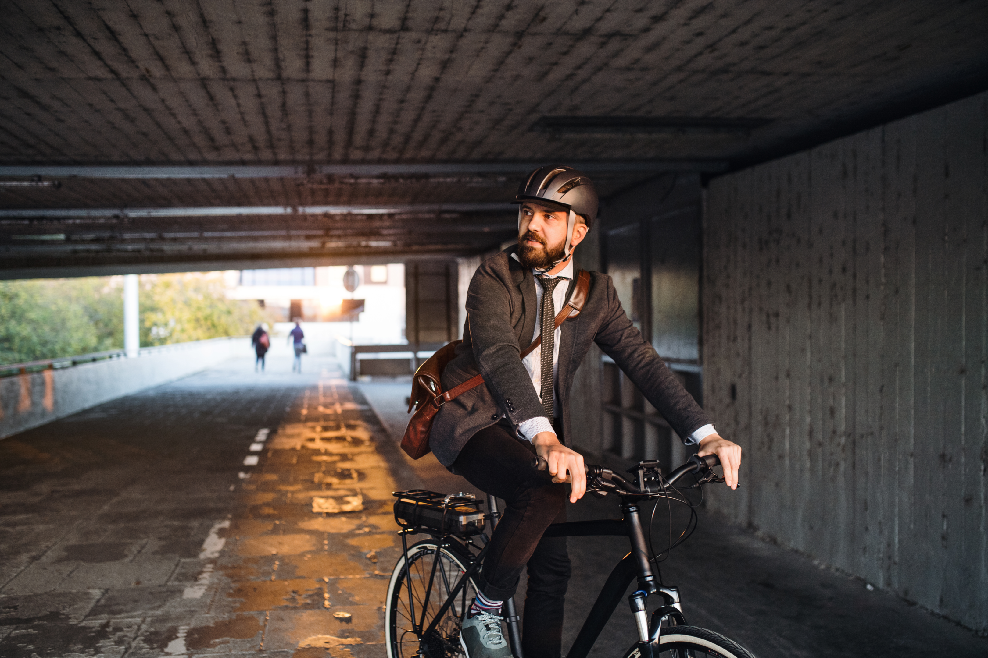 A man riding an electric bike on a city street
