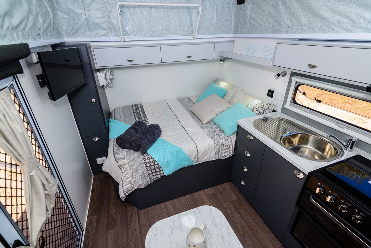 The 1800 has a simple bedroom with an east-west bed and the bunks plus convertable dinette and ensuite support the family.