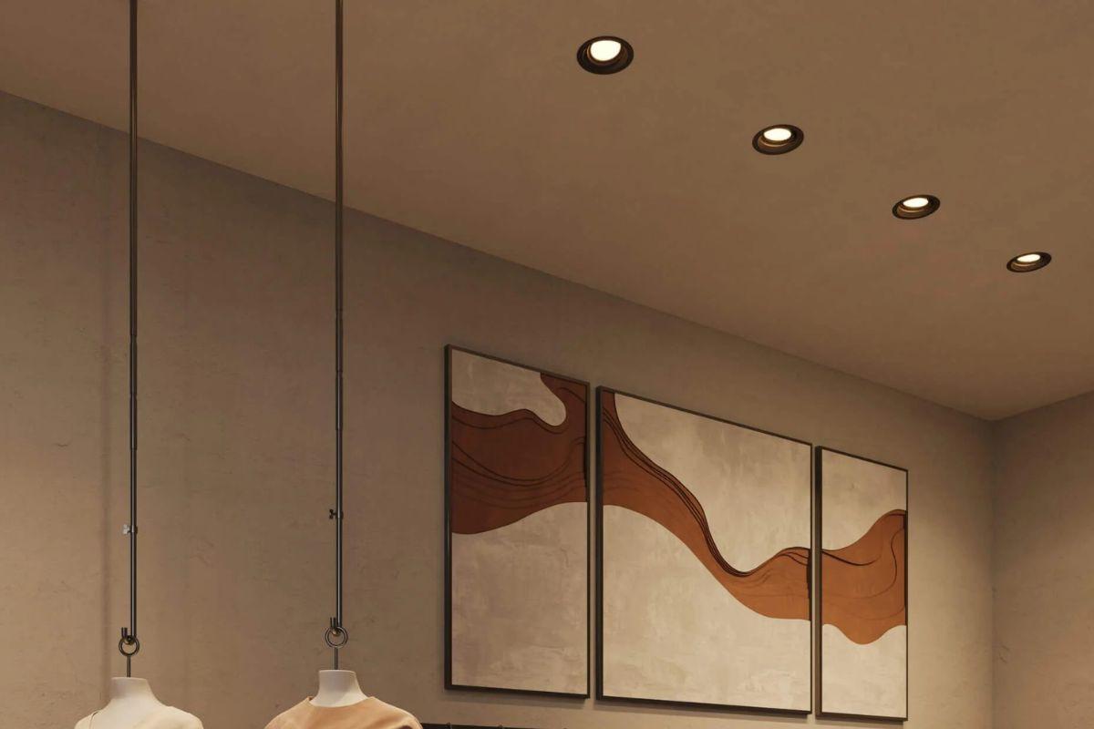 Warm interior with recessed ceiling lights providing accent lighting above wall artwork