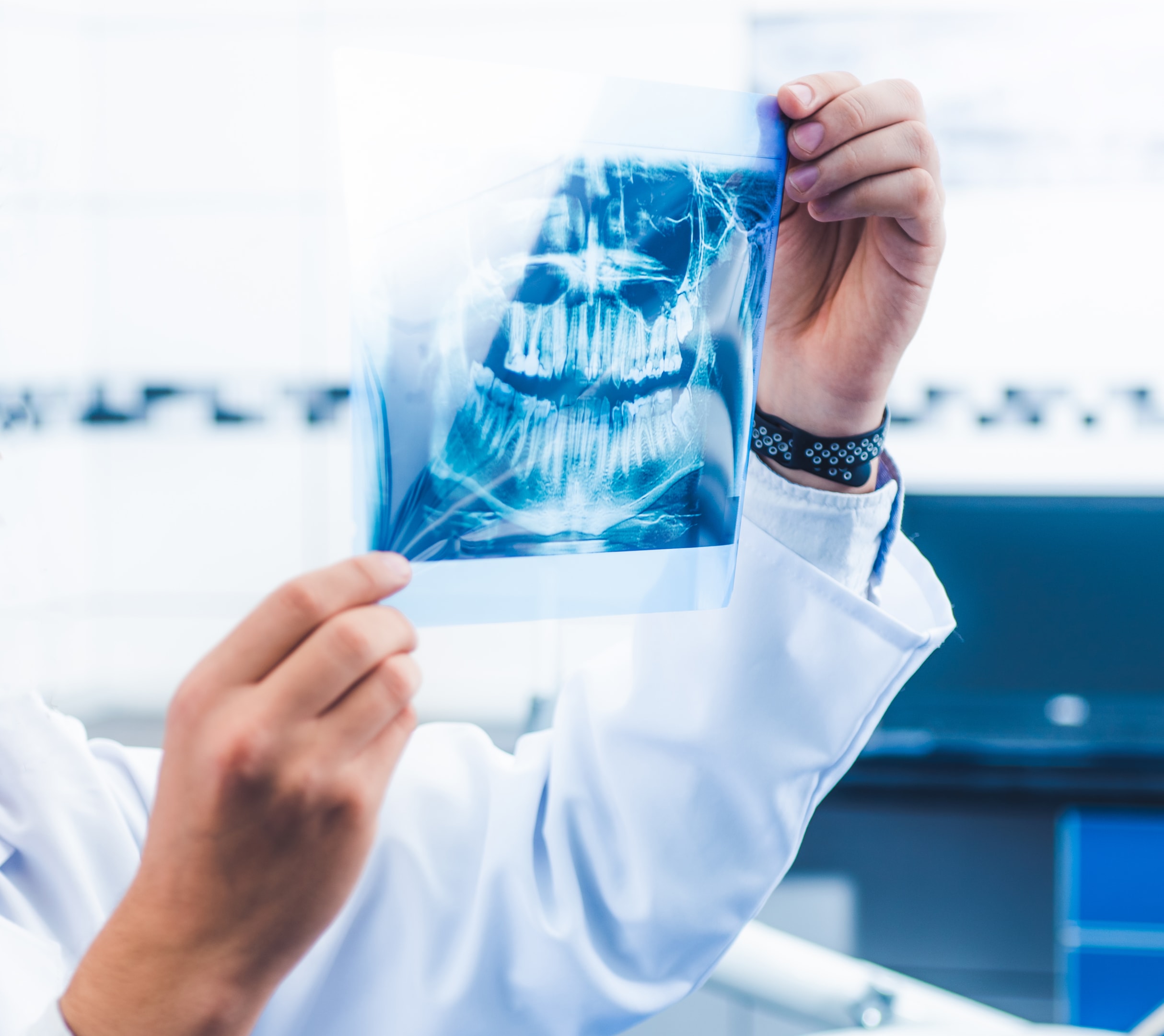 a doctor examining an x-ray to better prepare for a surgery