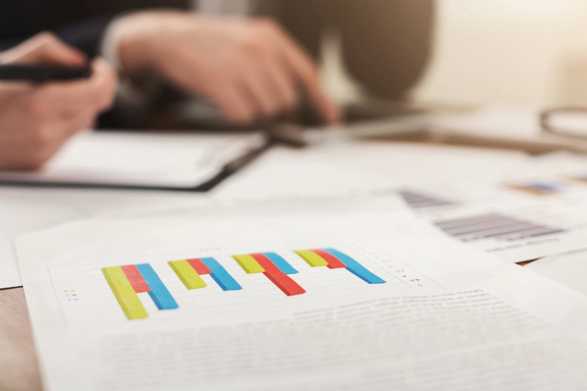 People reviewing documents showing how are companies valued.