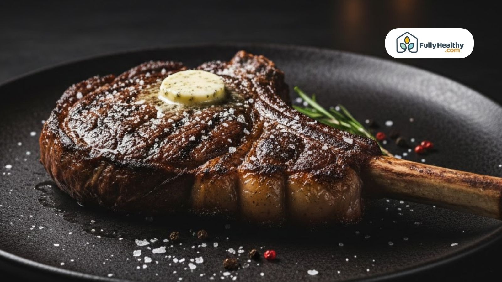 Cooked tomahawk steak with seared crust and butter.