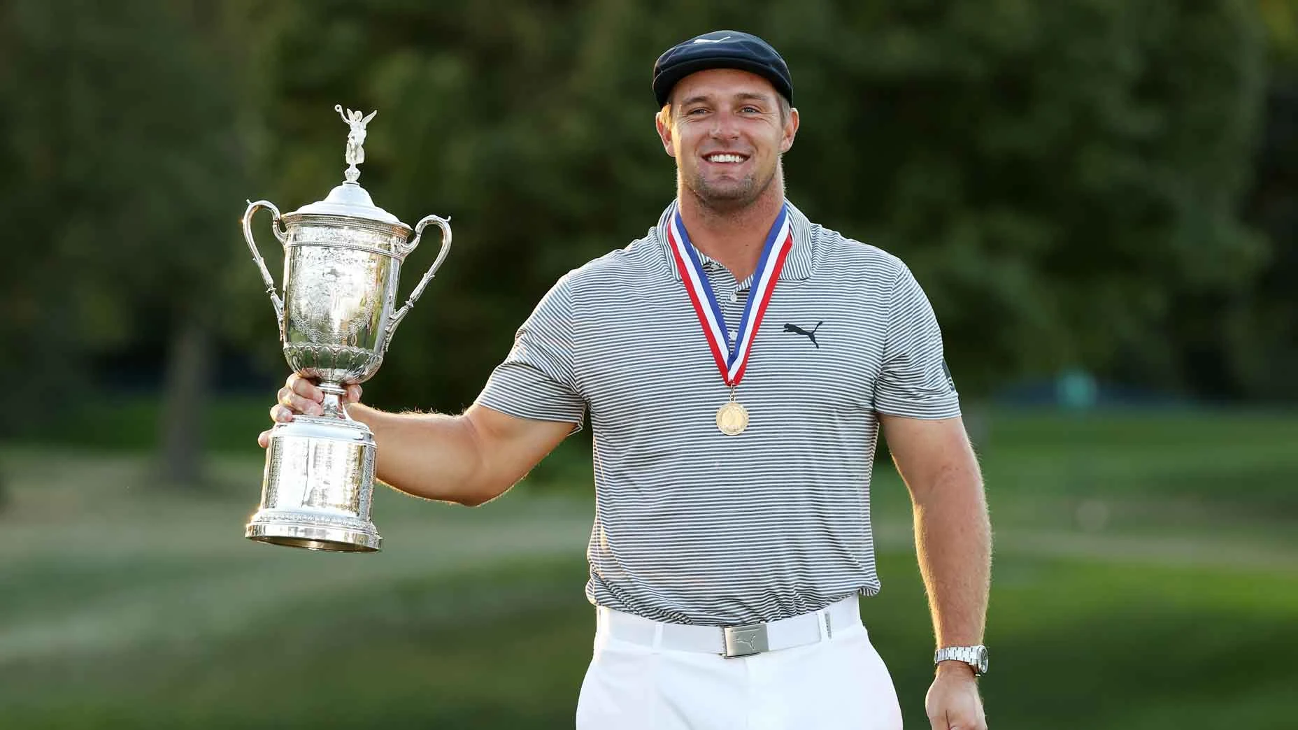 Bryson DeChambeau poses with the US Open trophy after winning the US Open in 2020.