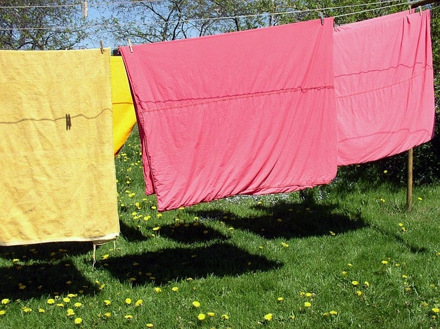 clothes line, laundry, meadow, summer, hang laundry, to dye, hang, cling, nature, dry laundry, outdoors, multi colored-wash, coloured, the shade, yellow, red, sheet, bed linen, duvet cover