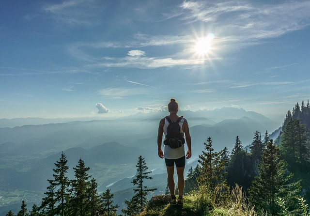 hiker, standing, woman, taking action for a particular result, not waiting forever like most businesses to form stronger customer relationships,