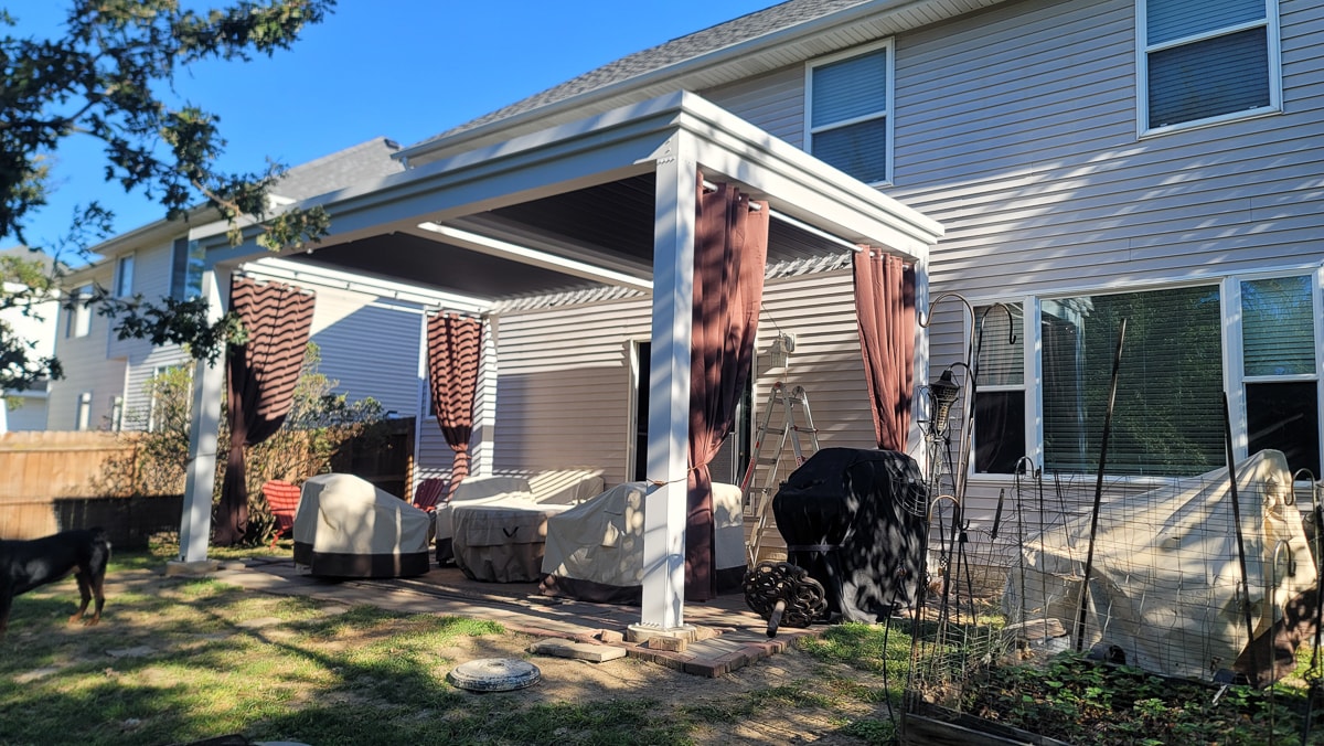 A pergola close to a house will avoid harsh weather conditions.