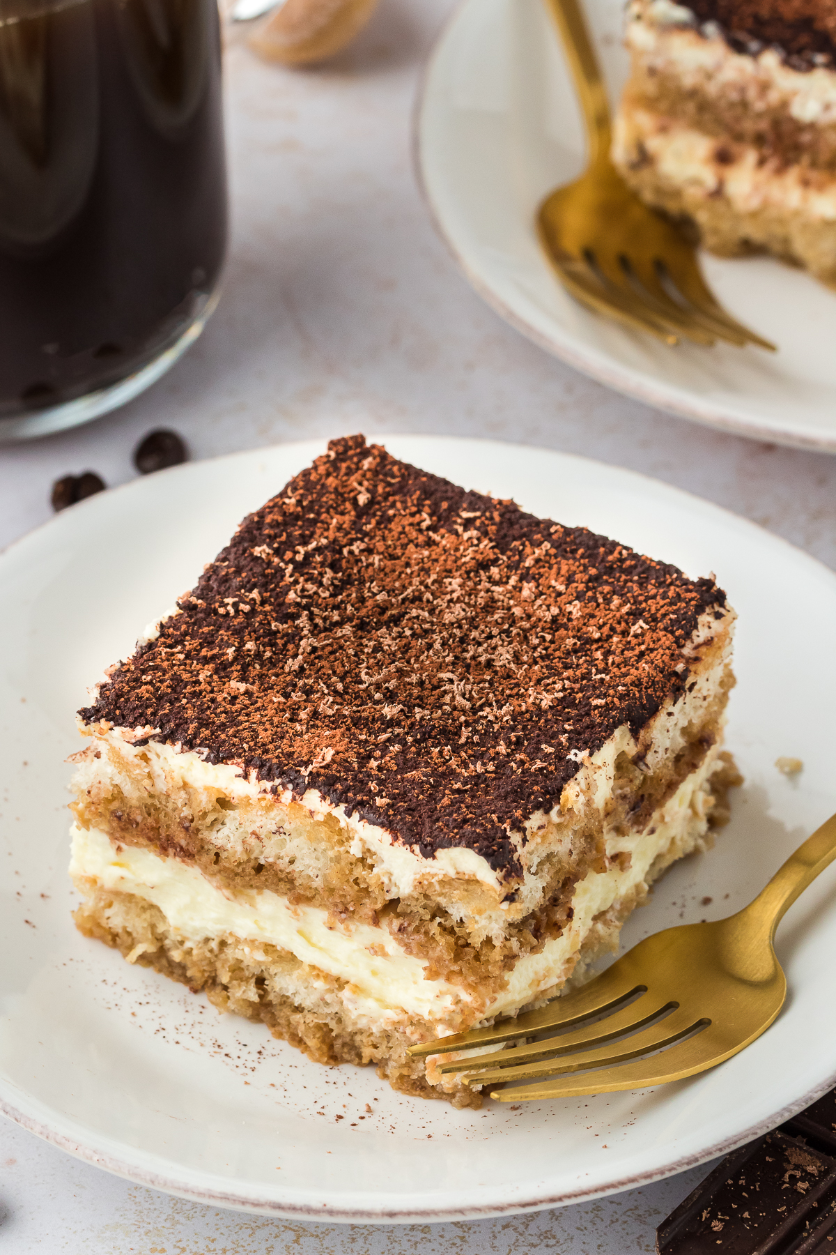 Tiramisu slice on a plate with a fork