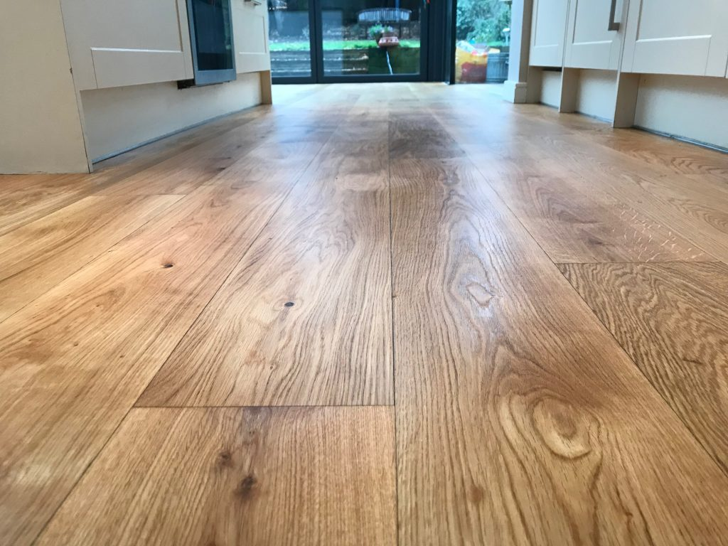 A wooden floor with a natural finish after being sanded