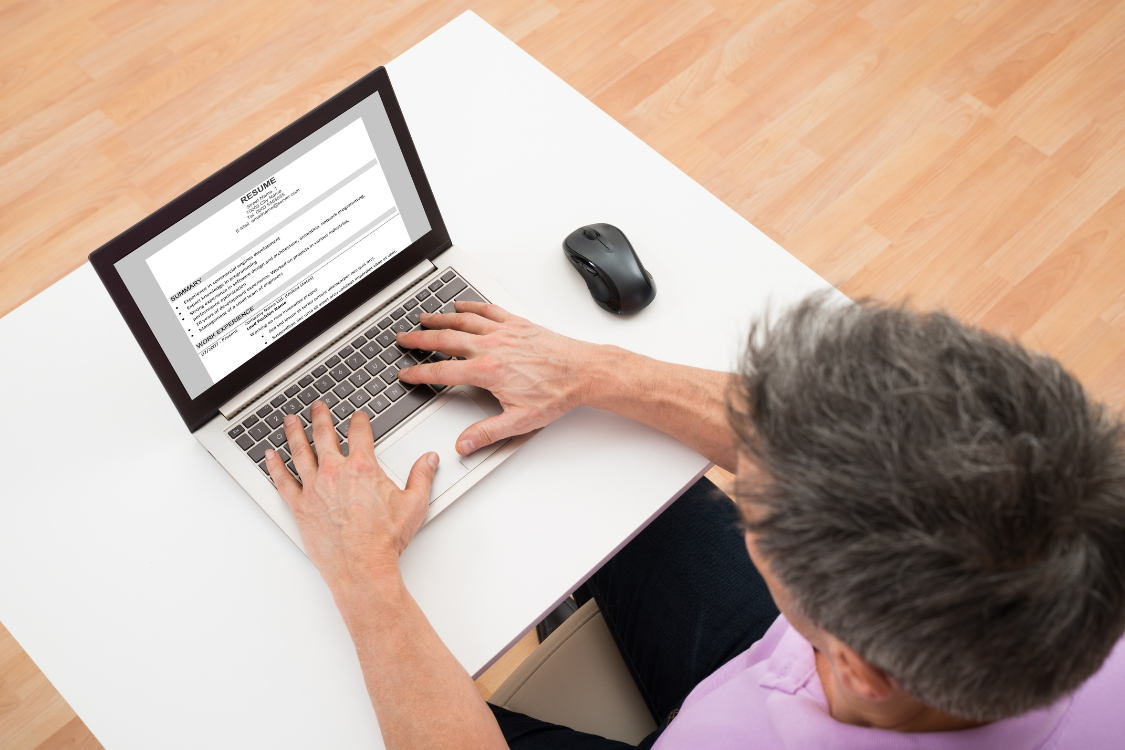 HR professional reviewing a formatted resume on a desktop screen in a hiring session