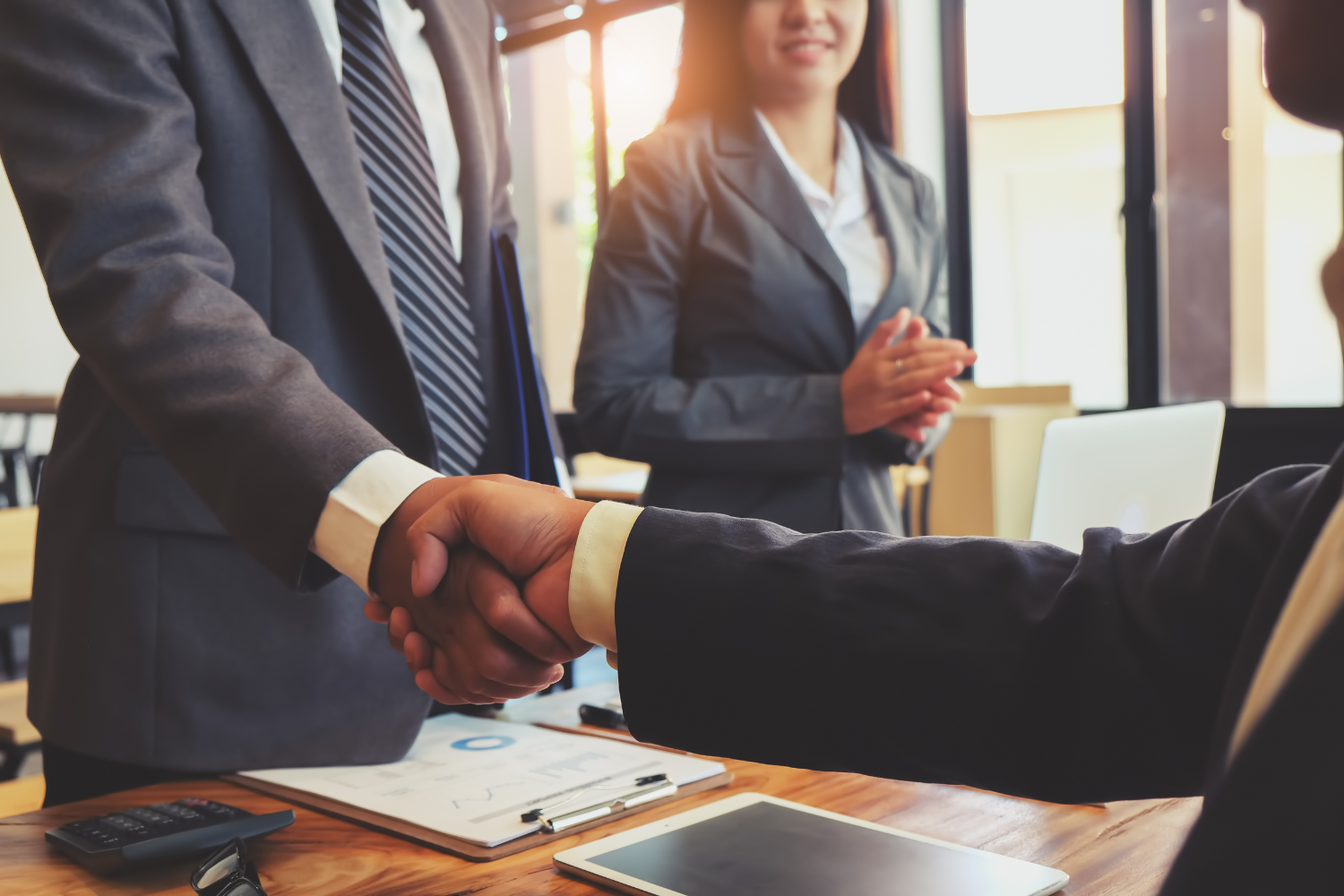 Two professionals shaking hands.