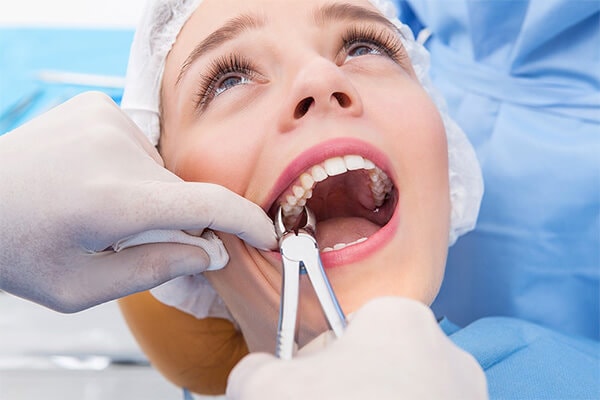 Patient getting a tooth extracted