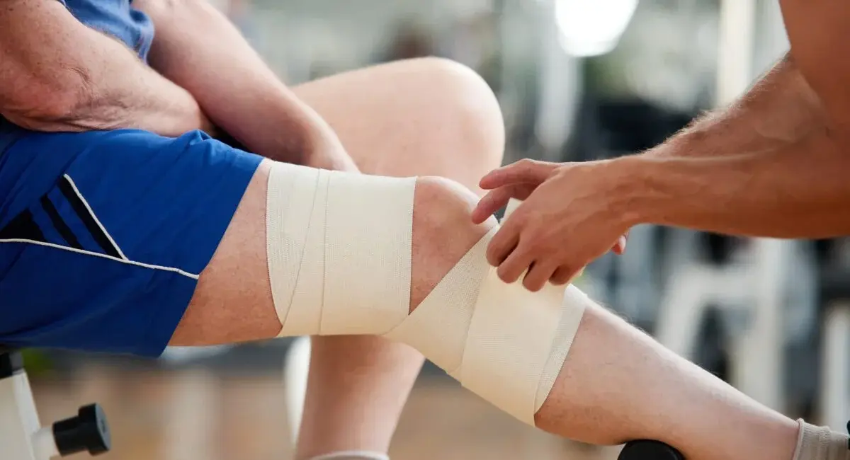 The image shows a clean and modern reception area of a physiotherapy clinic, featuring comfortable seating for patients. The welcoming environment is designed to promote physical health and well-being, reflecting the clinic's focus on providing quality physiotherapy services for various conditions, including sports injuries and chronic pain.