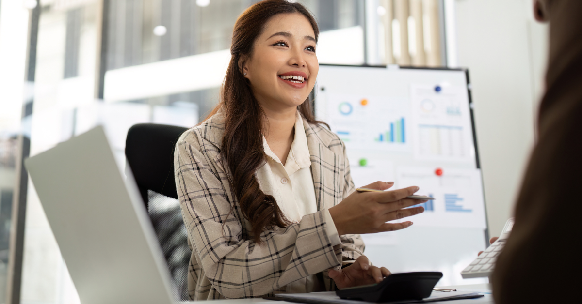Female accountant explaining tax deductions and answering common questions to ask an accountant.