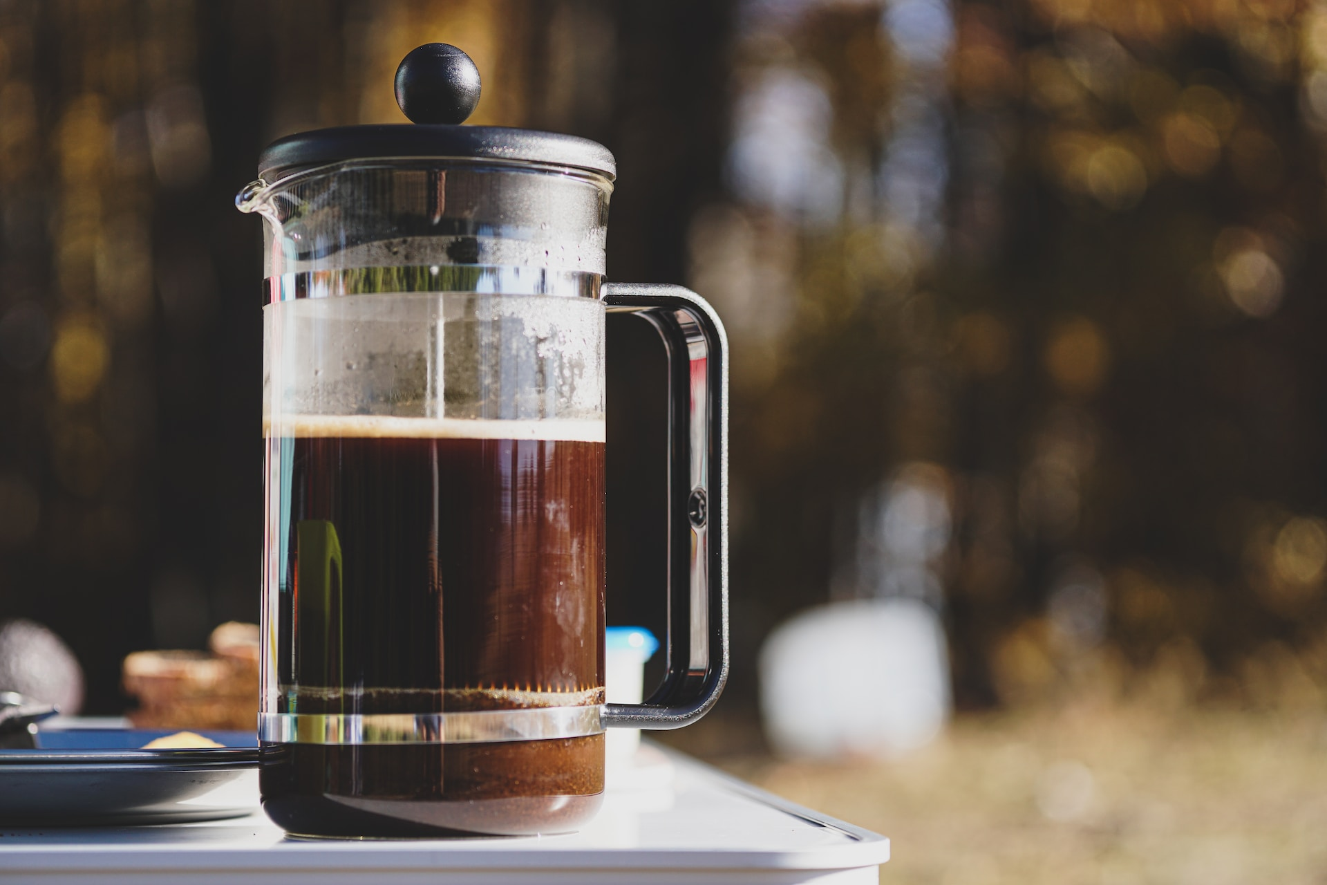 An aesthetic shot of a French Press full of gorgeous homemade coffee