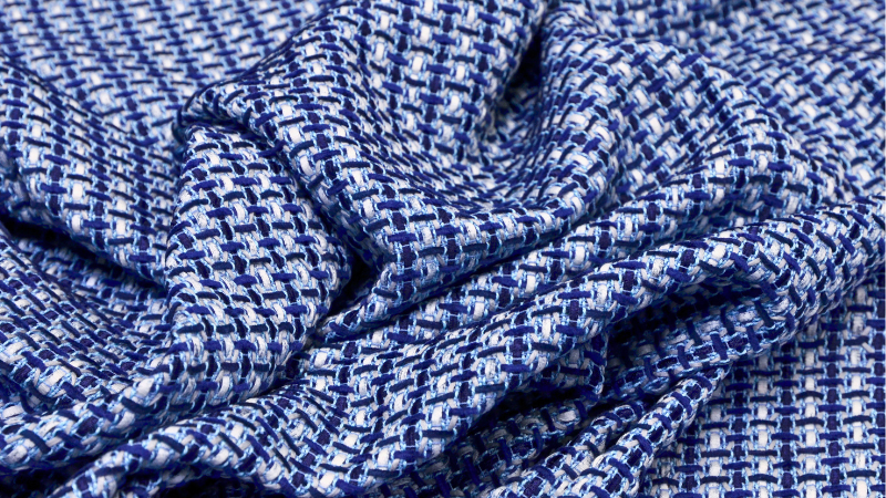 A close up of a blue and white checkered cuprammonium rayon fabric