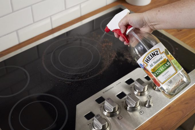 Clean a glass stove top with vinegar