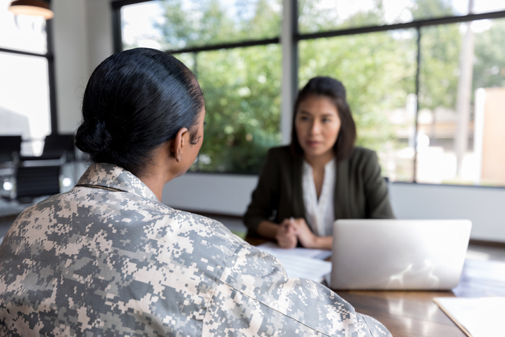 Female veteran talking with a career counselor. 