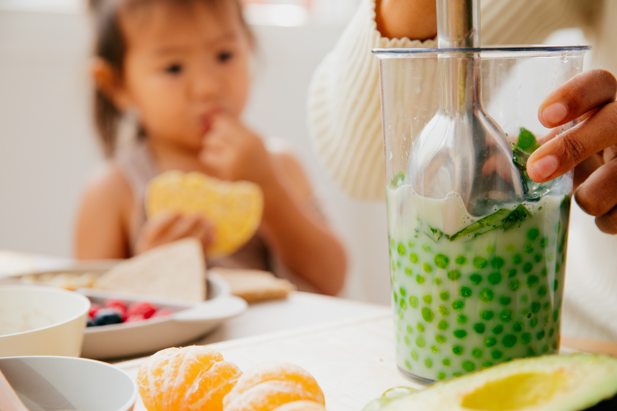 A little girl feeling involved preparing their food