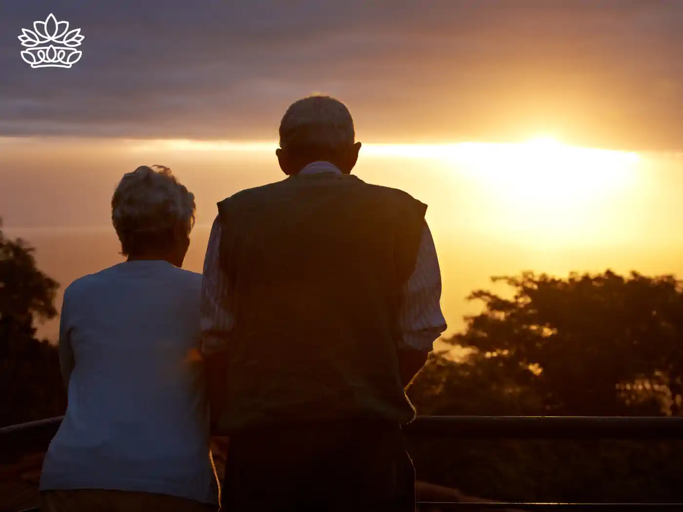 An elderly couple watching the sunset together, symbolising enduring love. Fabulous Flowers and Gifts. Romantic Flowers