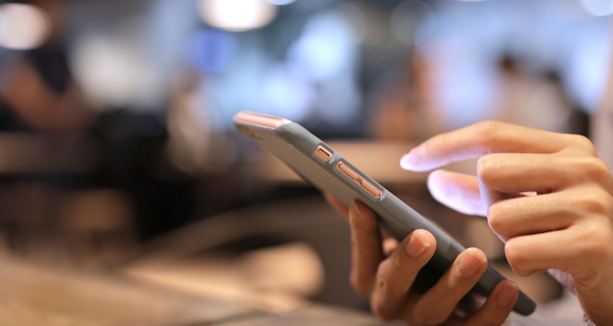 Mobile banking payment to a merchant account by a customer on their phone