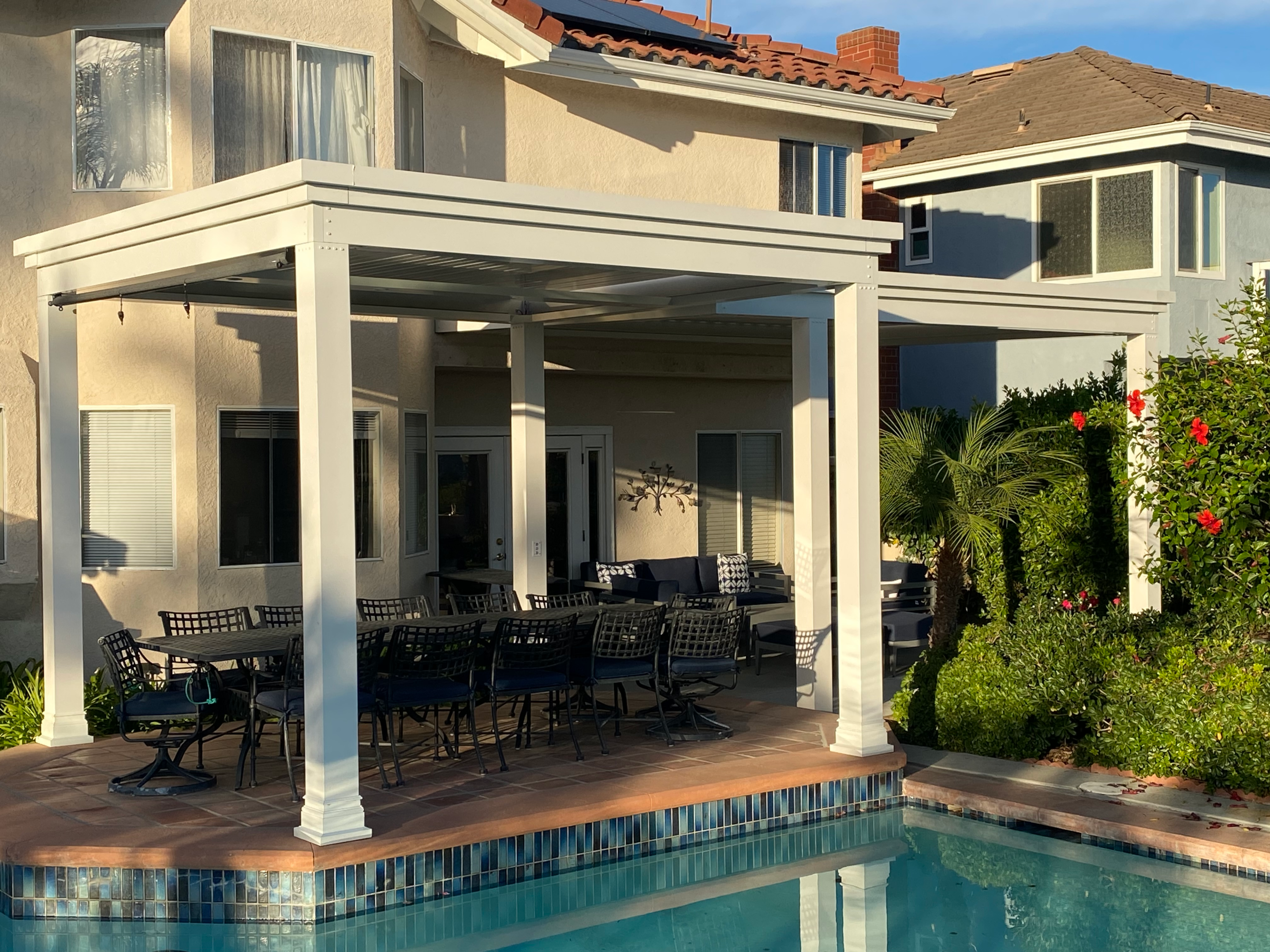 Luxurious poolside pergola with elegant design and seating area