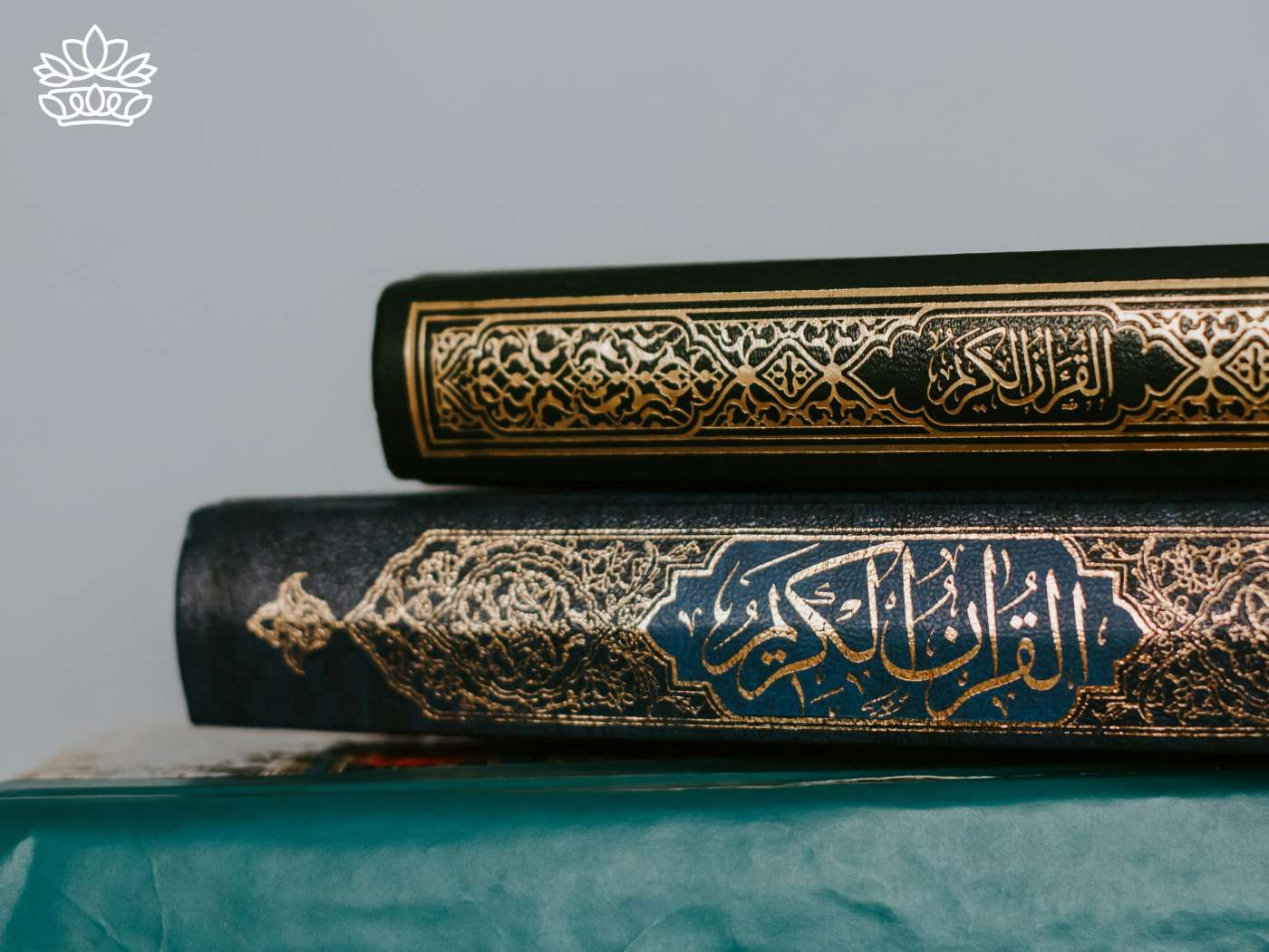 Ornately decorated Islamic books in Arabic, symbolizing Ramazan Bayramı, used during morning prayer, often accompanied by the tradition of wearing new clothes, a significant practice for Muslims, part of the Eid Collection by Fabulous Flowers and Gifts.