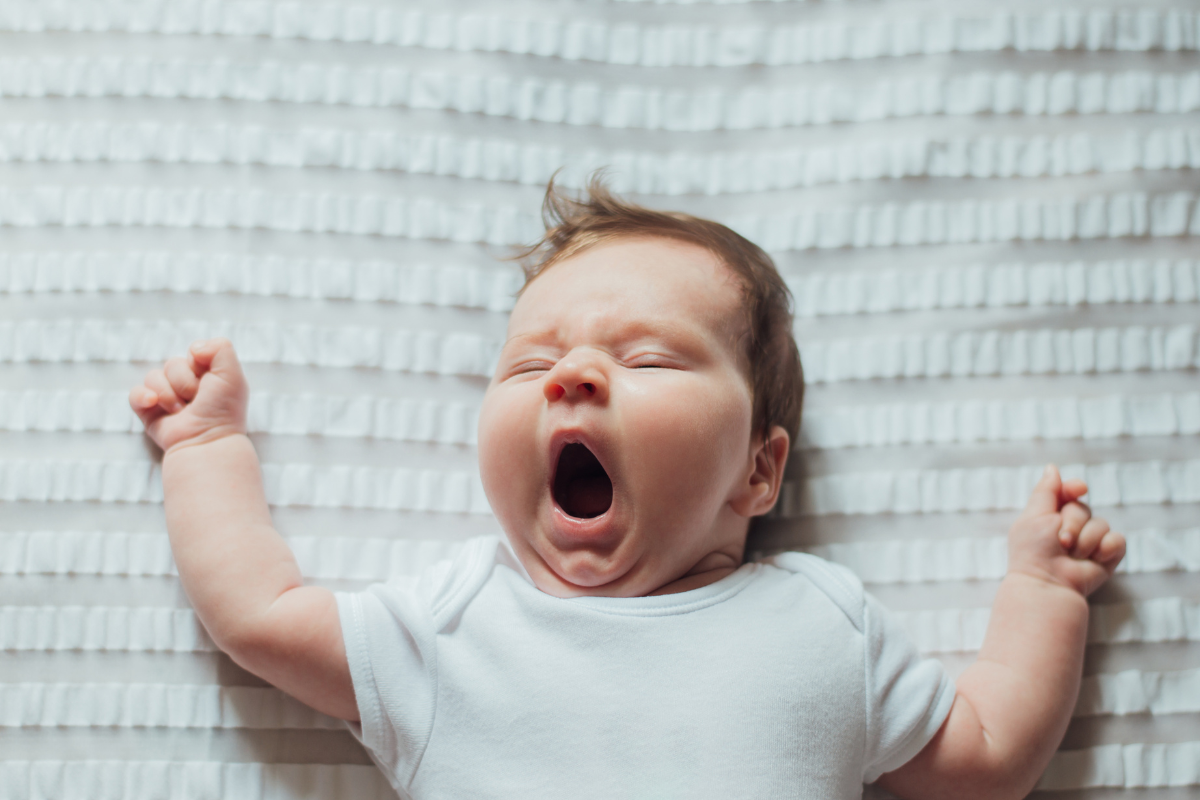 Yawning baby at bedtime