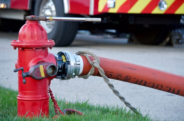 Fire hydrant with fire hose connected