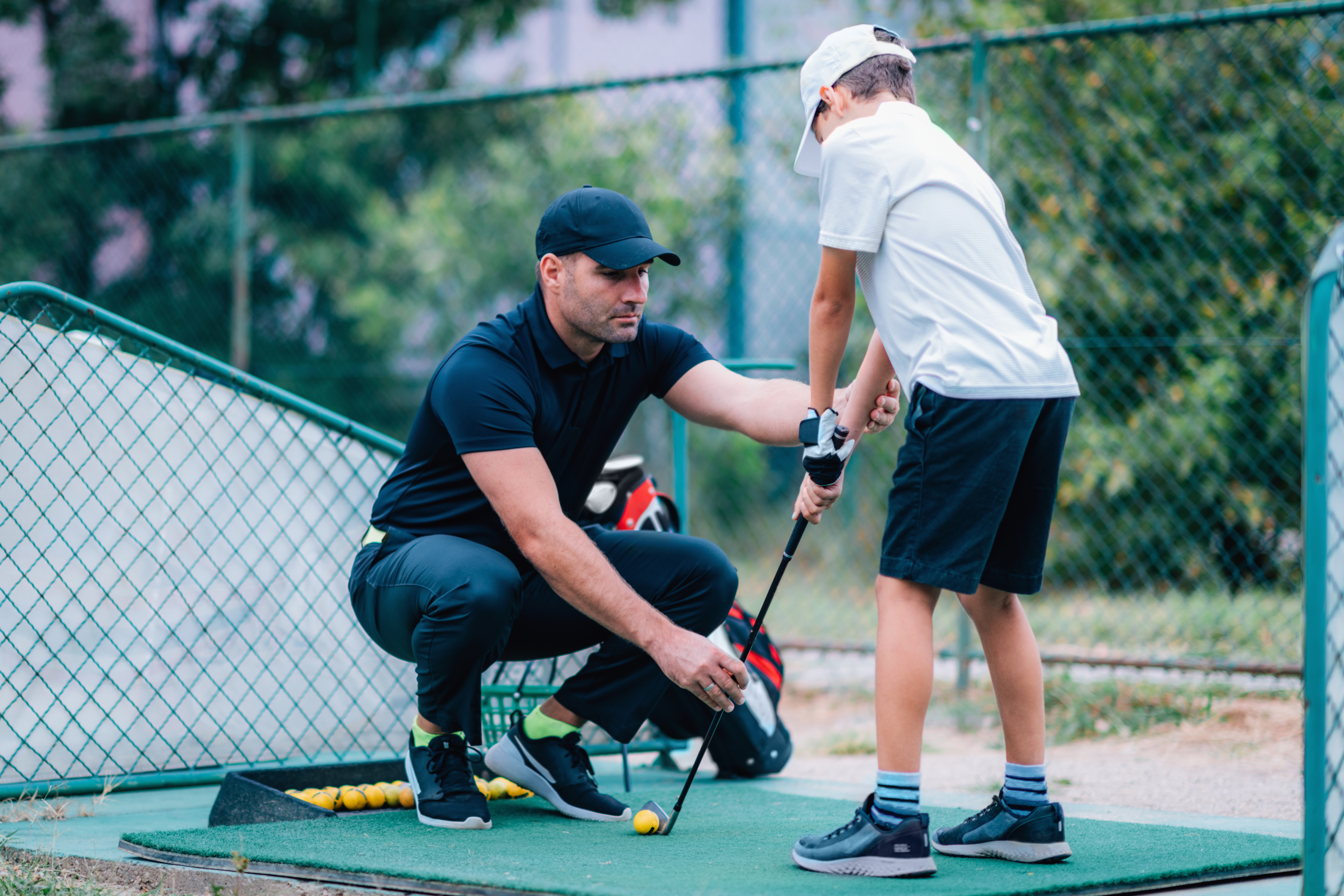 golf professional gets in contact with student for his golf lessons