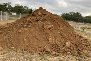 An excellent job digging a pile of dirt, ready for soil removal (a large amount)