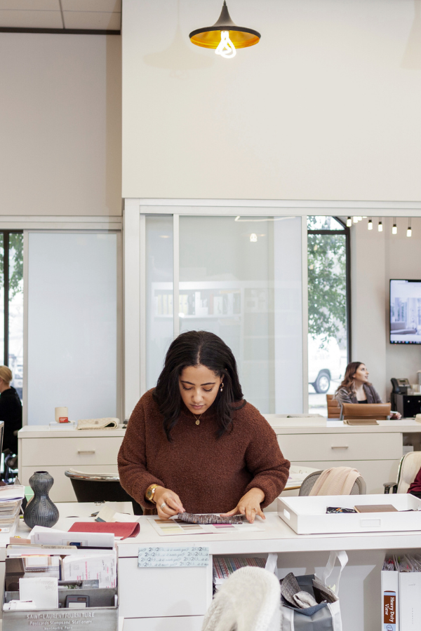 a designer laying down samples