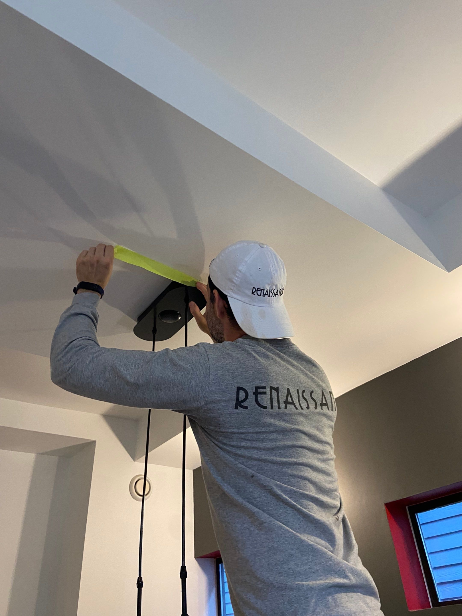 A professional painter taping 
