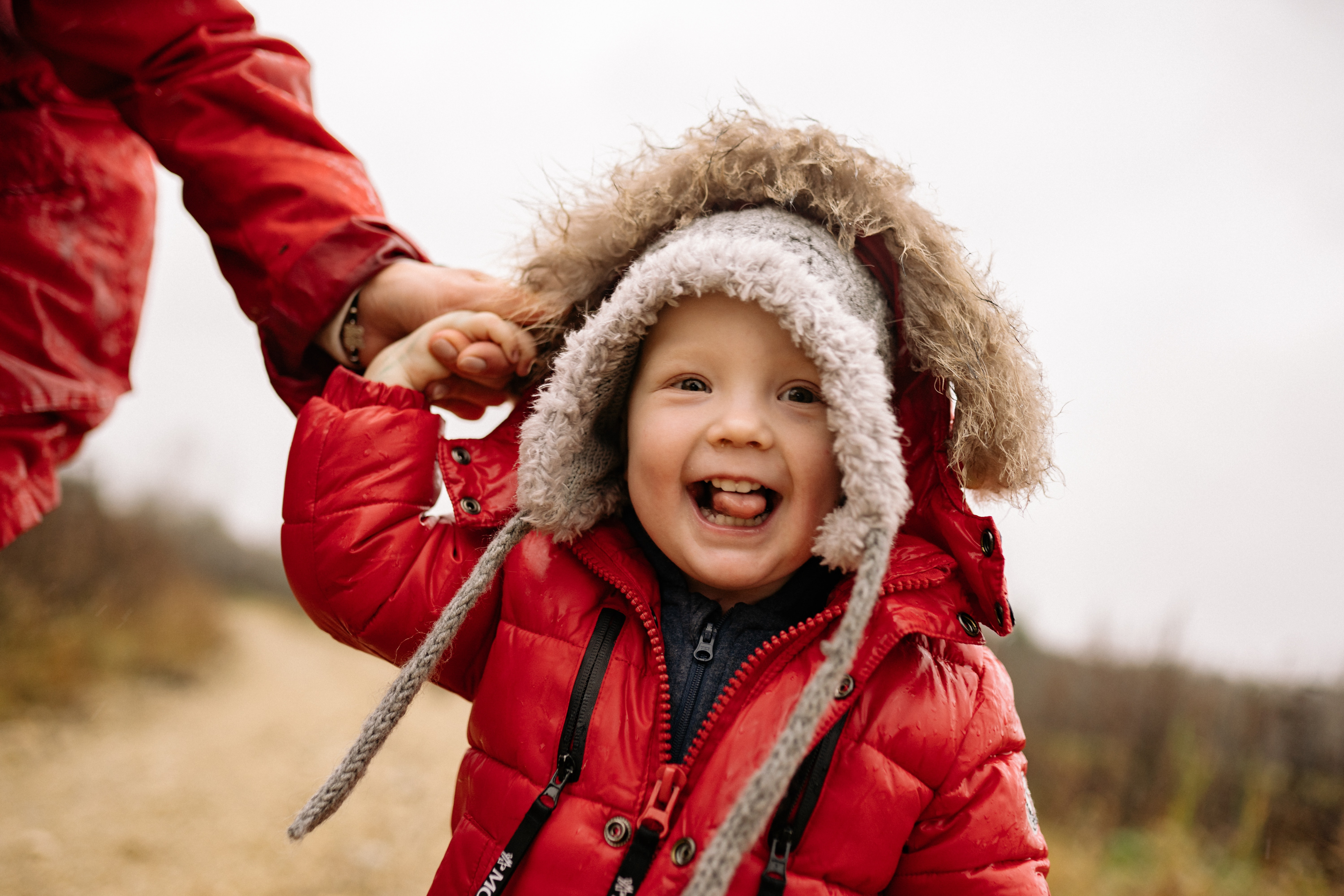 young child in a red snow suit