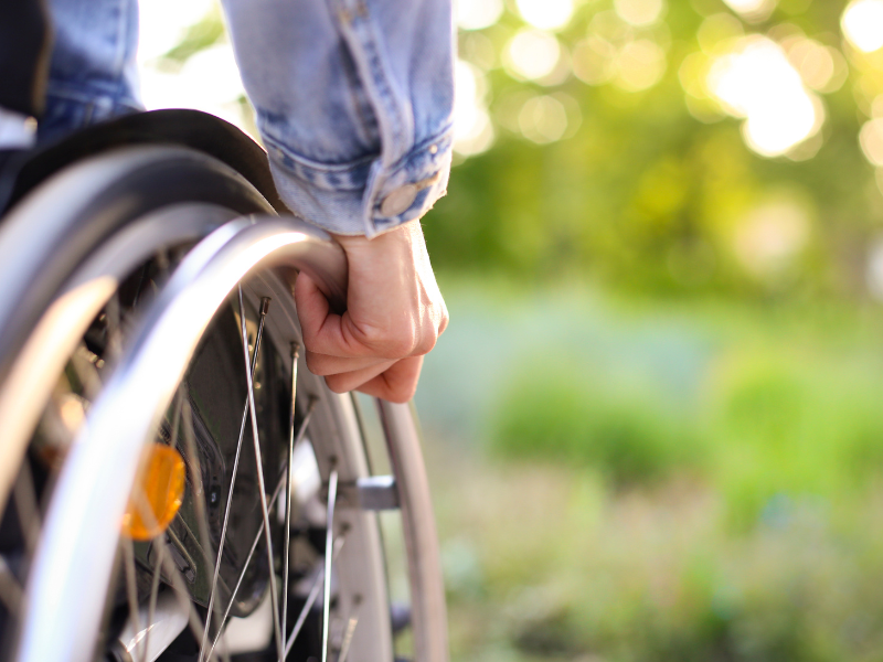 Image of a person managing a wheelchair.