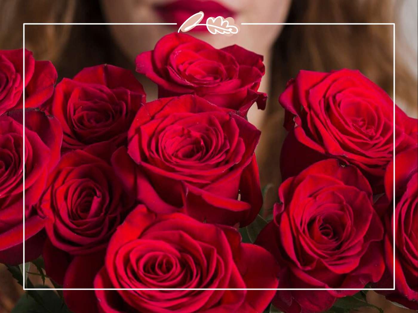 Valentine's Day Gifts Flowers - Fabulous Flowers & Gifts close-up of rich red roses with a blurred face in the background
