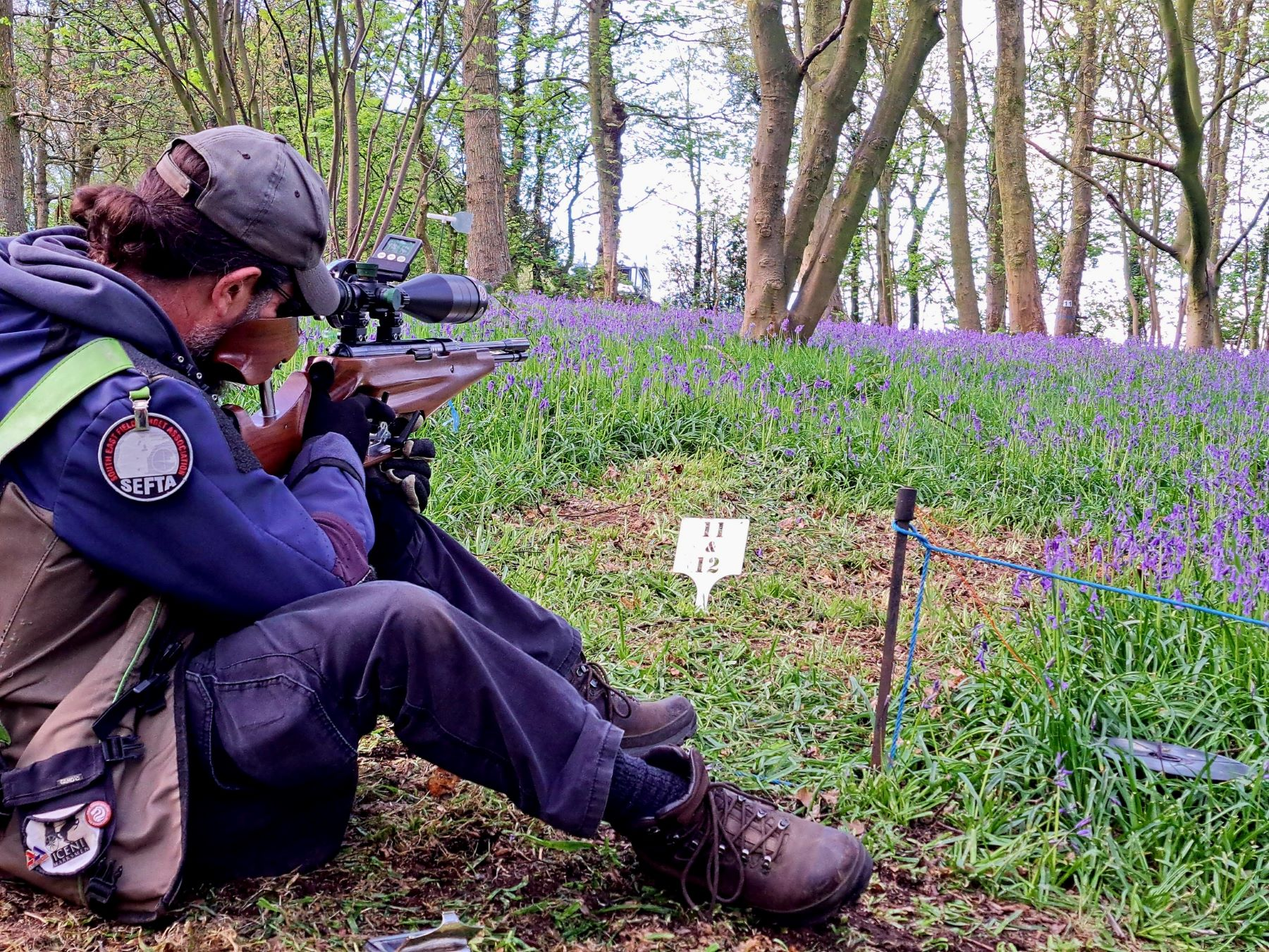 Steve Carter, New Air Arms Spring gun team member, shooting through the bluebells at Redfearns