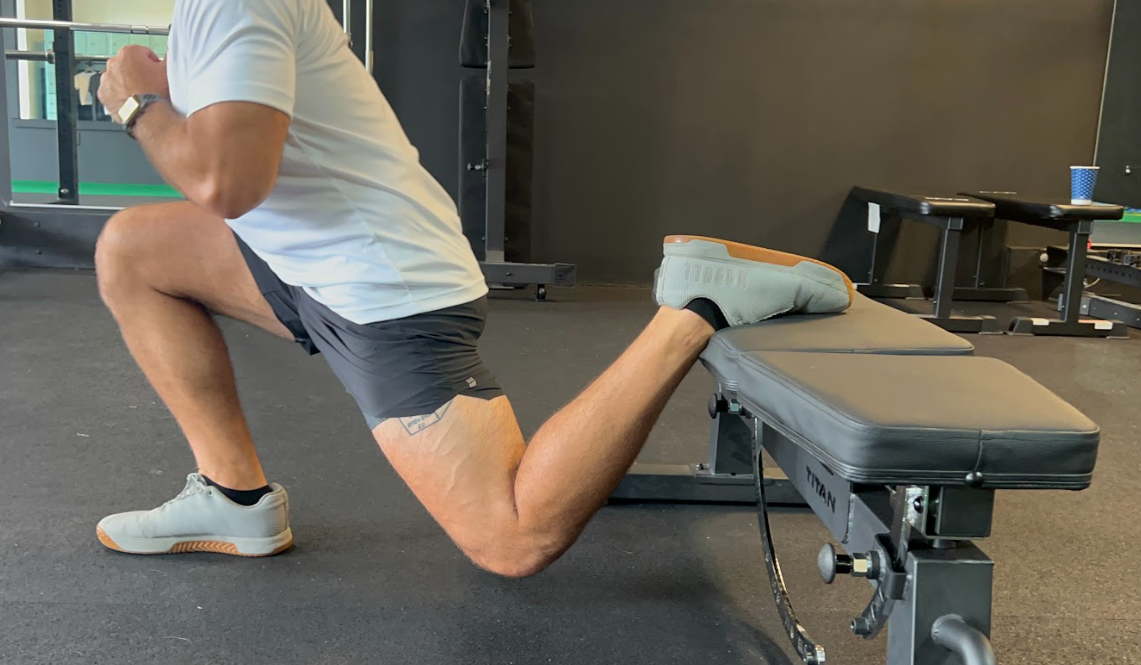 While lower body exercises like the reverse lunge and dumbbell squat bring you serious gains on your leg muscles, there's nothing quite like isolating the tension on one leg at a time. You can get the most of this tension on your front leg when you hold your position