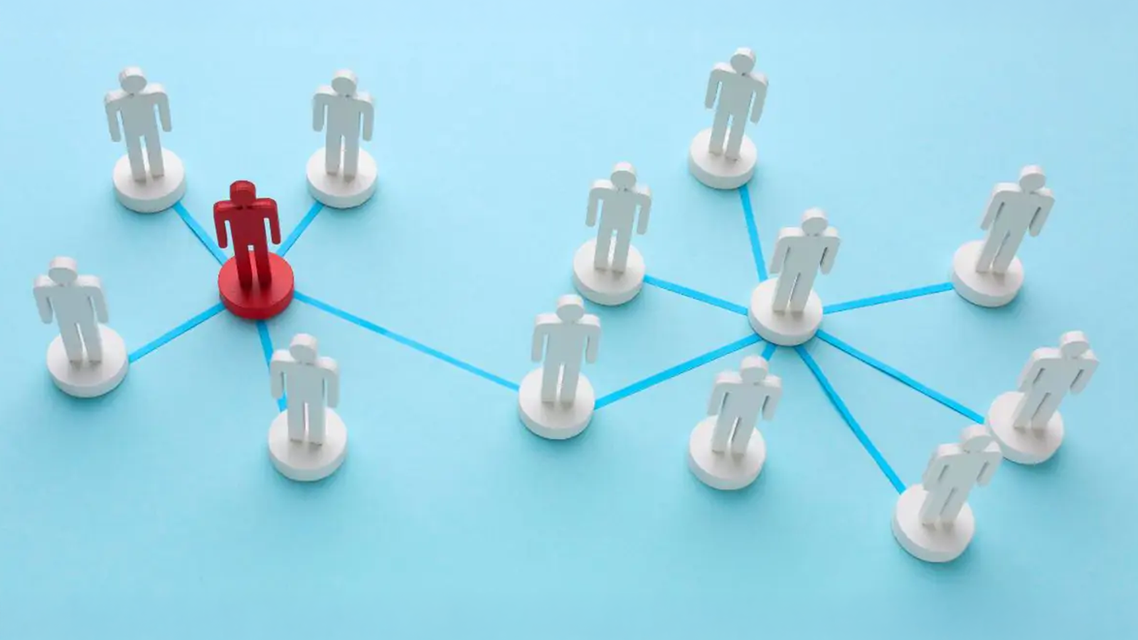 Network of white and red user icons connected by lines, visualizing how cloud PBX scales phone numbers and team size for changing business needs.