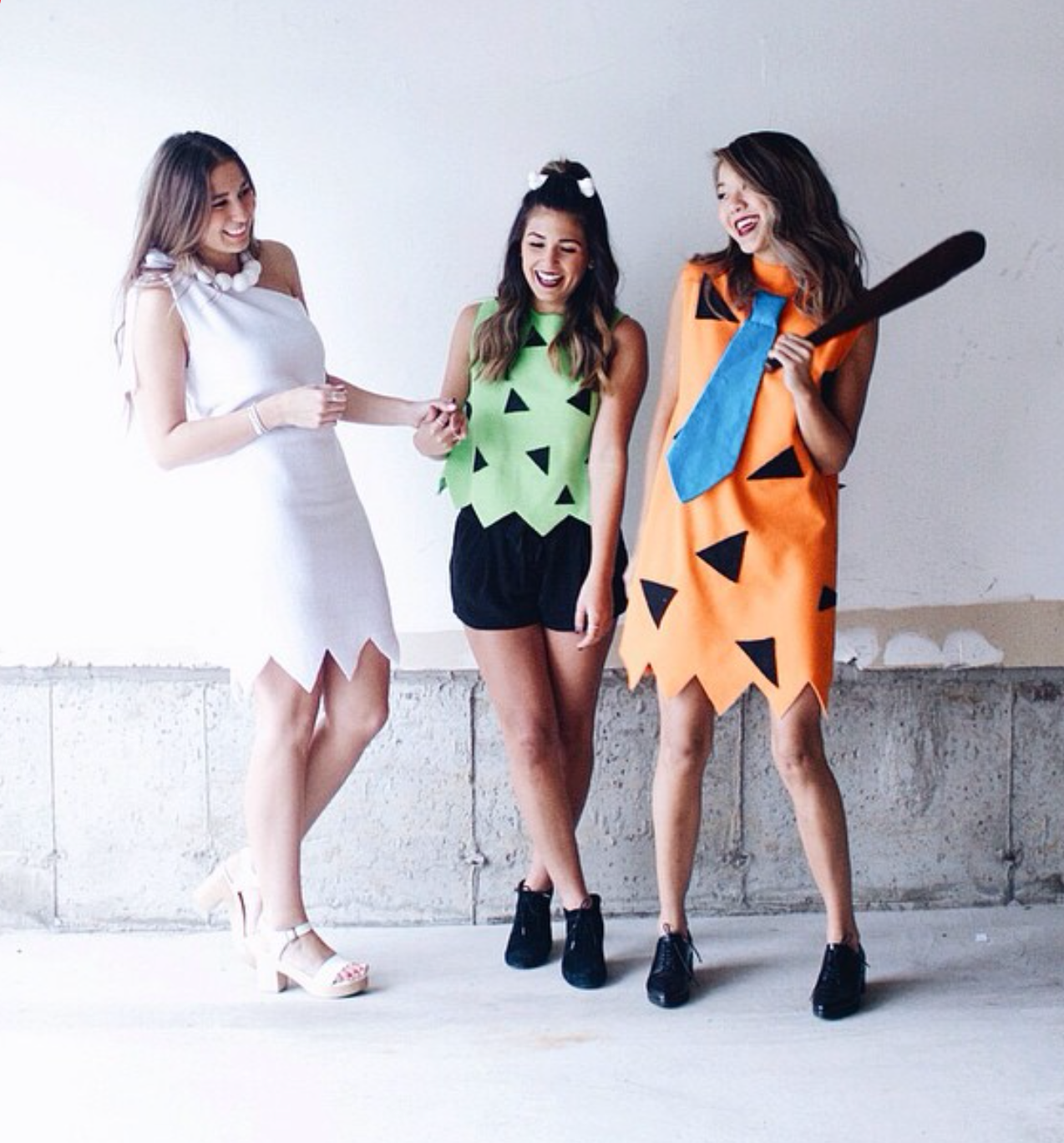 Group halloween costumes - Two friends plus on - wear the Flinstones costumes with your group