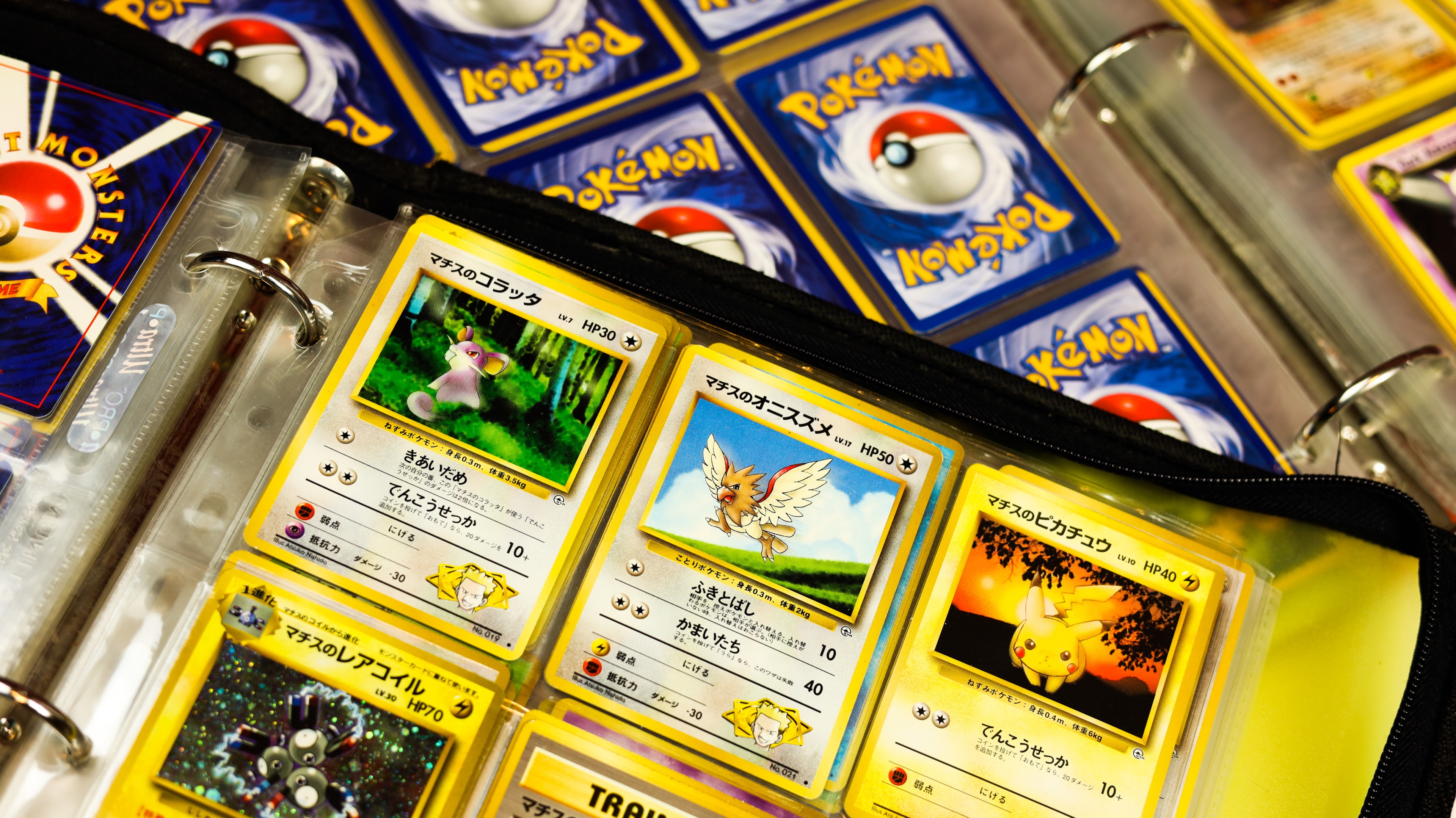 Japanese Pokémon trading card game in a binder