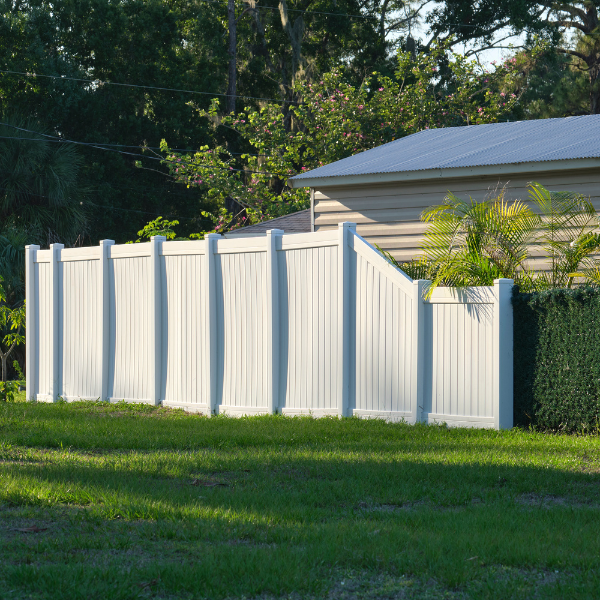 An image showing a durable and low-maintenance vinyl fence in a residential setting.
