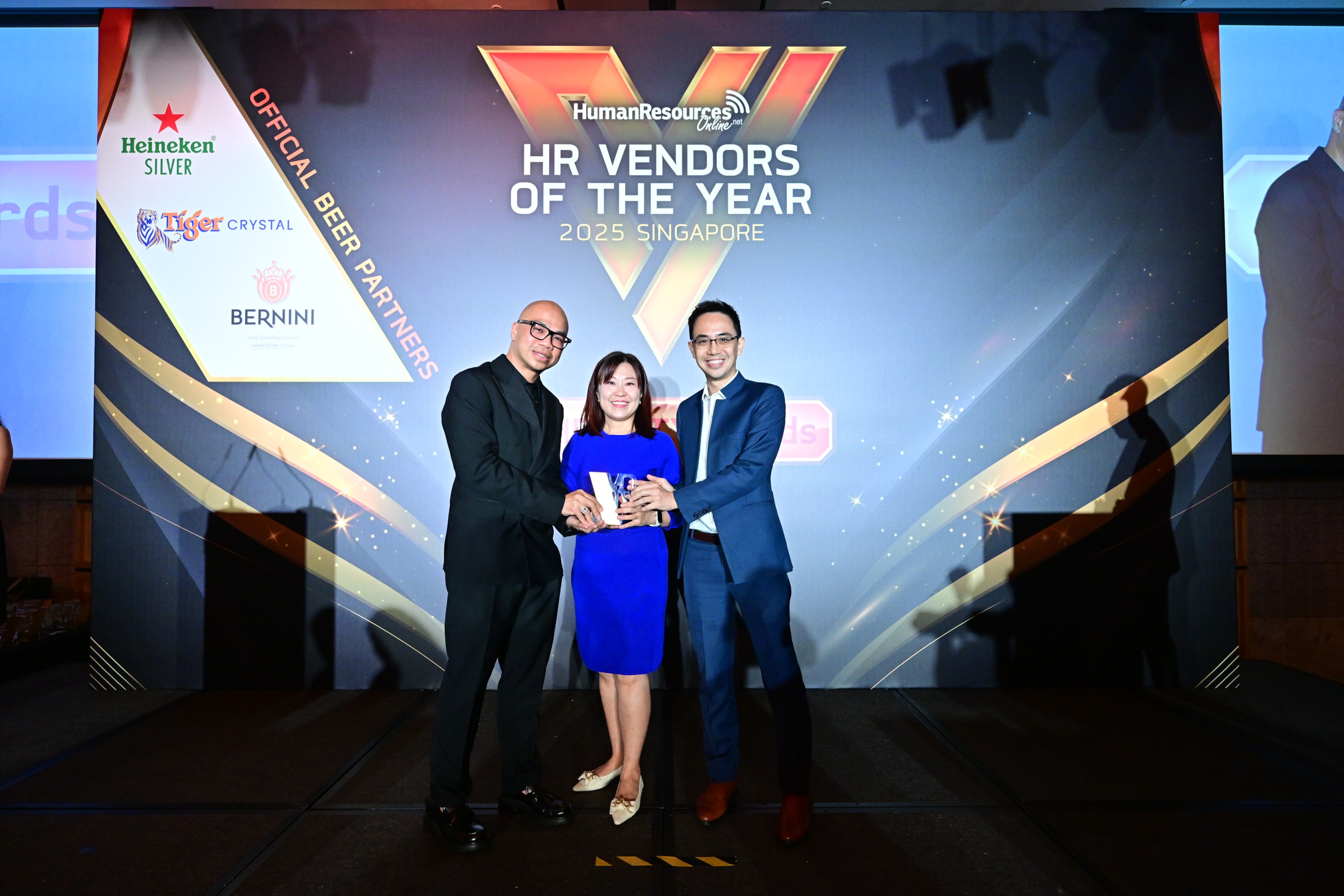 Deep Impact awarded Gold for Best Leadership Development Consultancy at HR Vendors of the Year 2025 in Singapore (pictured with judge)