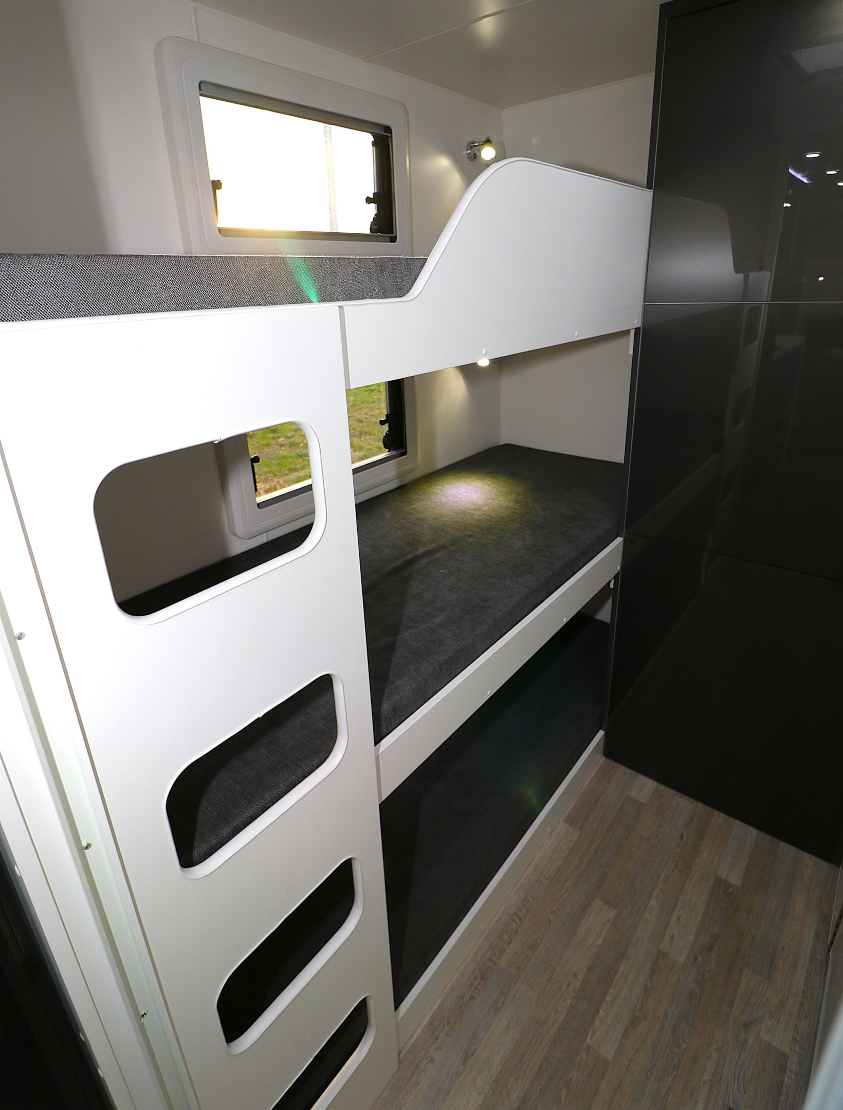The luxury layout of the Franklin 220 features the option of three bunks on a twin axle trailer.