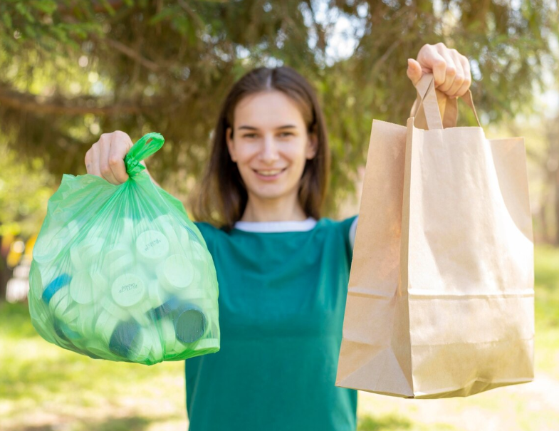 Woman holding plastic and paper bag 