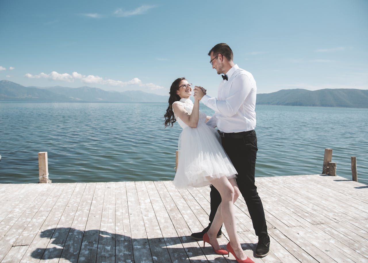 Couple dancing on a pier