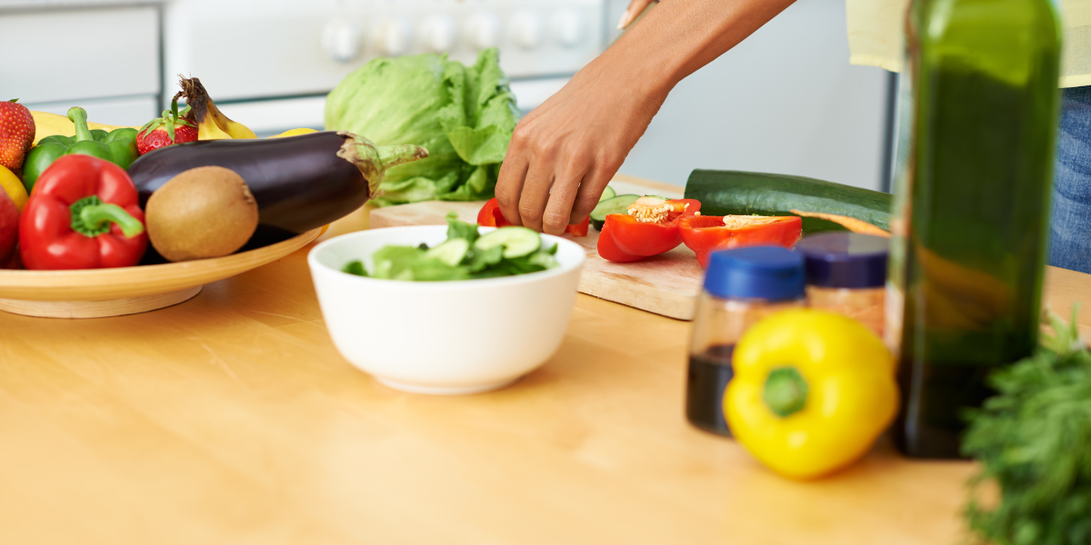 A healthy lifestyle is important for those trying to lose weight. Counter covered in fruits and vegetables. 