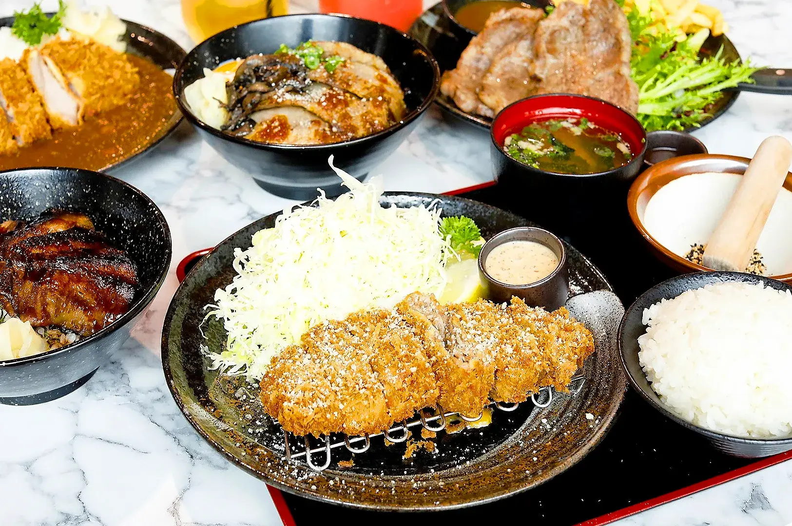 Japanese tonkatsu set meal at Gochi-So Shokudo Singapore with crispy pork cutlet, rice, miso soup, and shredded cabbage.