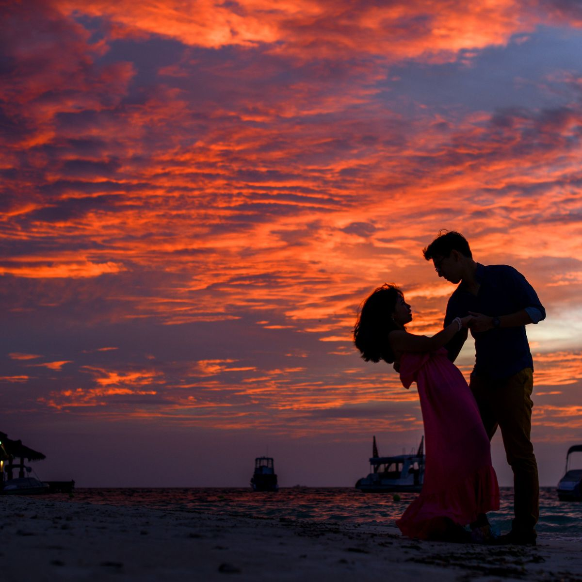 man and woman dancing in sunset - Featured in: How Does A Taurus Man Test A Woman